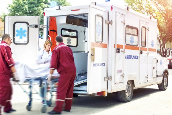 Medical emergency team helping injured man